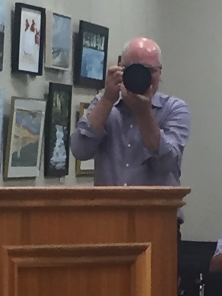 Seglins taking pictures of the mayor