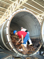 Workers unloading an autoclave